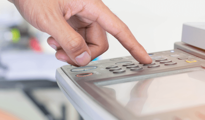 Pressing the button on the printer